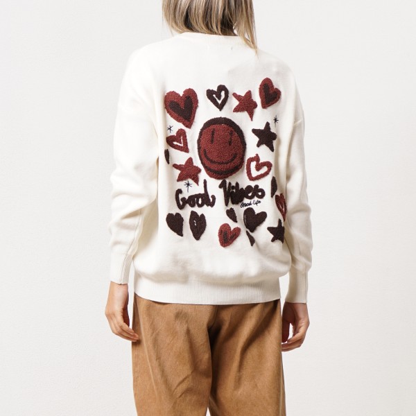 Knitted sweater with embroidered appliqués