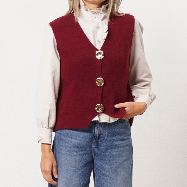 Knitted vest with gold buttons