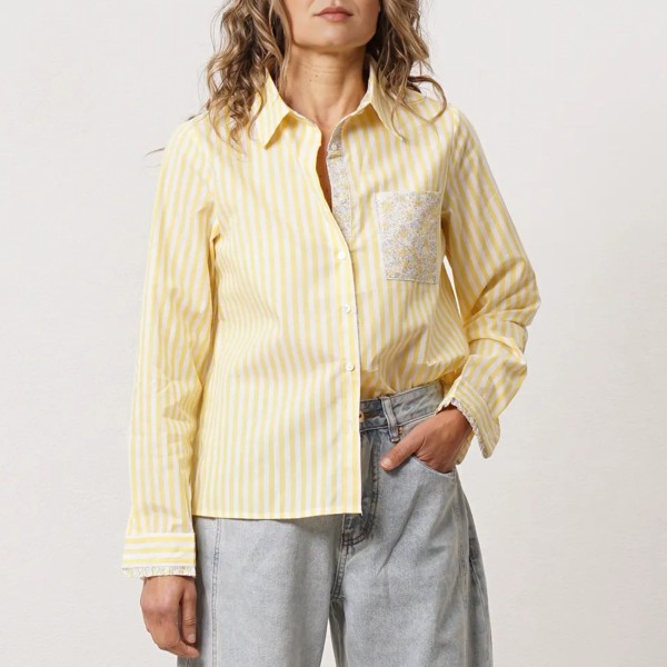 Striped blouse with a mix of fabrics and ruffles