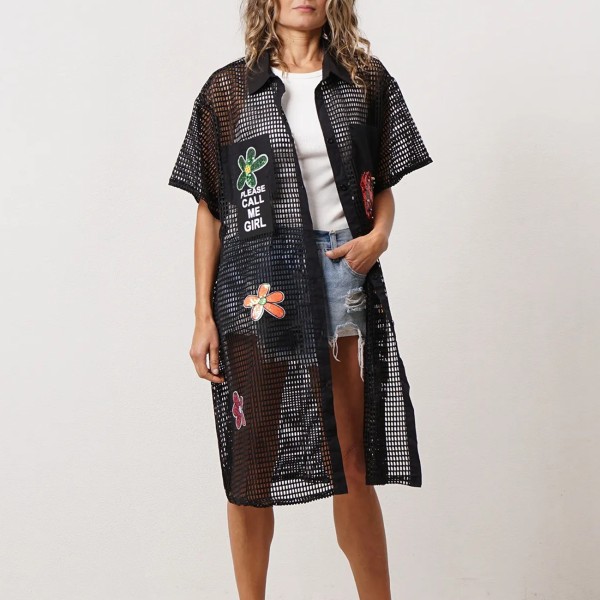 Dress with buttons down the front and colorful appliqués